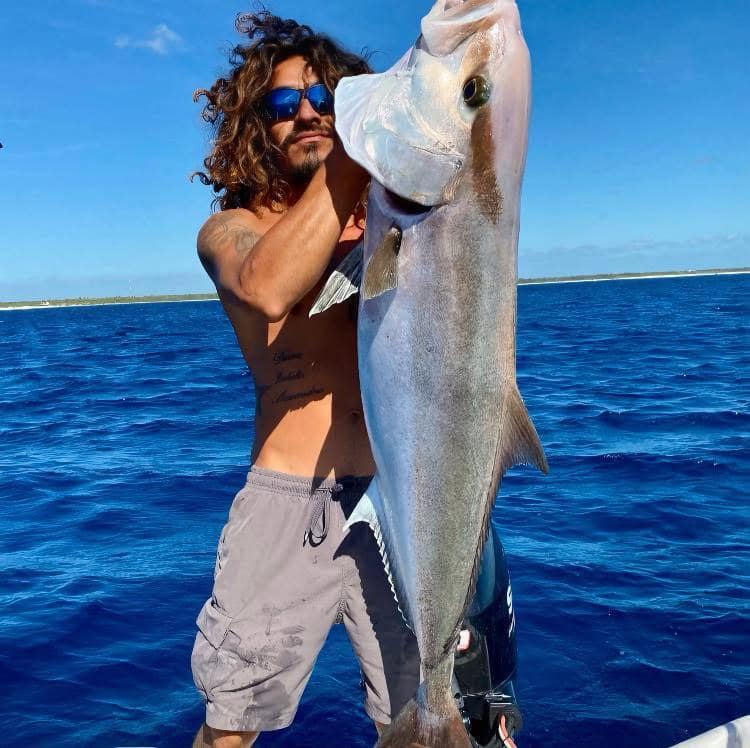 Client with a jack fish caught during private fishing tour in Akumal Bay