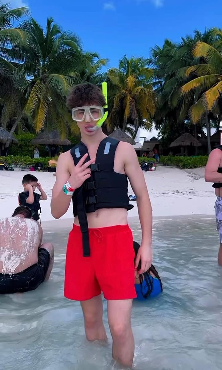 Group of friends on Akumal beach ready for their sea turtle snorkel tour with Akbay Tours